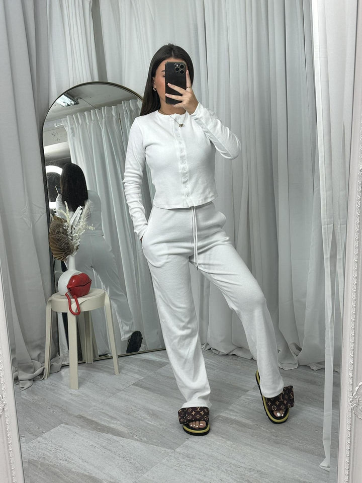 Kvindernes hyggelige strik jumpsuit med knapdetaljer og elegant design Skovae