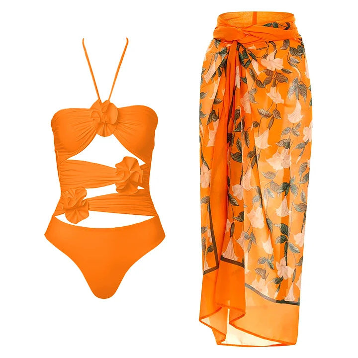 Dame svømmedragt med blomstret design og raffineret cut-out-look Skovae