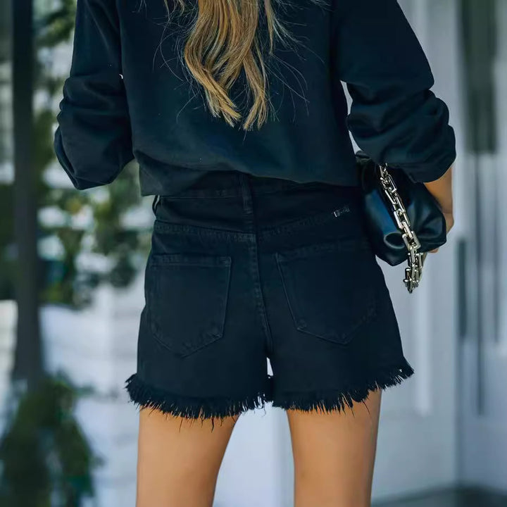 Dame denim-shorts i afslappet destroyed stil med frynset kant Stilla