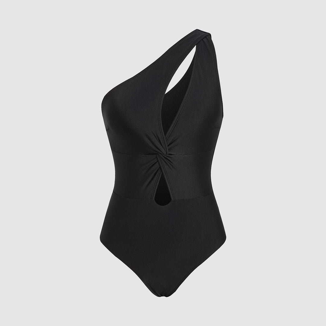 Dame ét-delt badedragt med asymmetrisk design og moderne cut-out Stilla