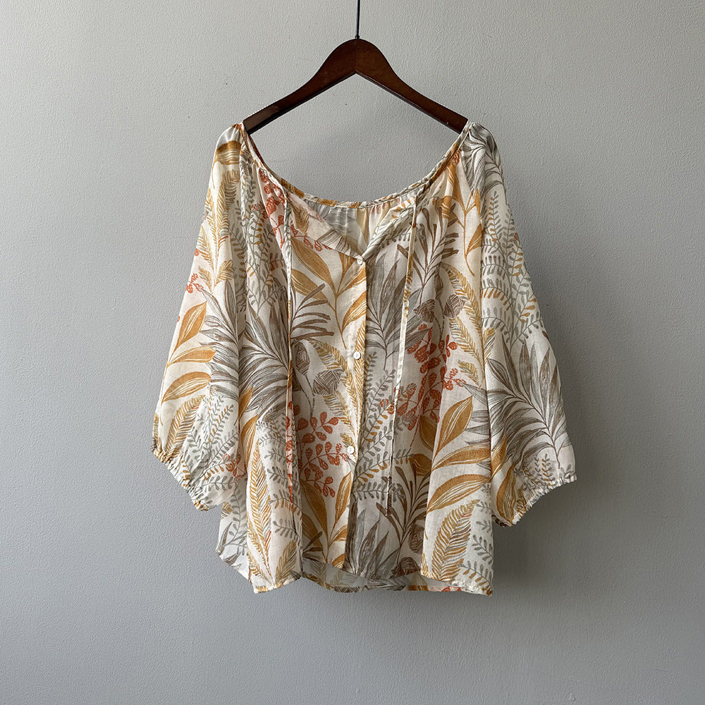 Damebluse med blomstertryk og justerbart bindingbånd Stilla