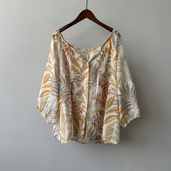 Damebluse med blomstertryk og justerbart bindingbånd Stilla
