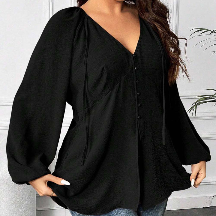 Dame elegant bluse med V-udskæring og dekorative knapdetaljer Stilla