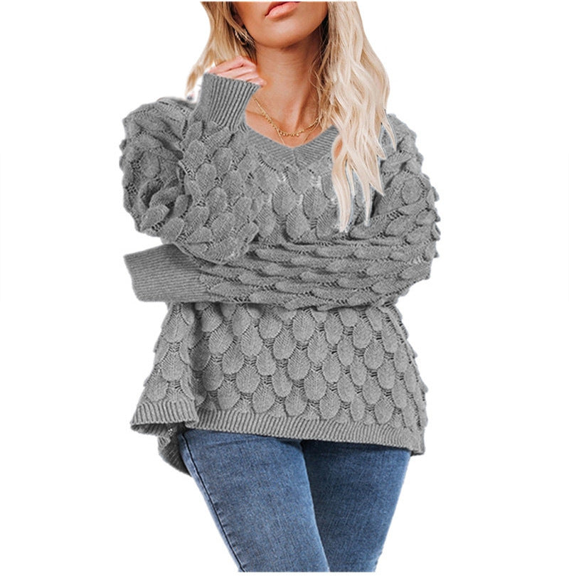Kvinders chunky strikket sweater med skulpturel bølgemønster og V-hals Stilla