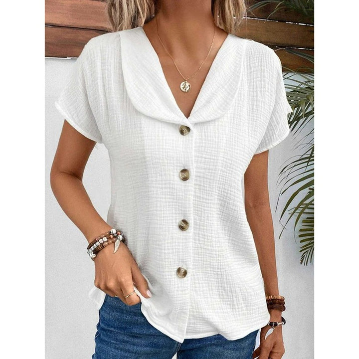 Damebluse med synlige knapper lavet af let stof Stilla