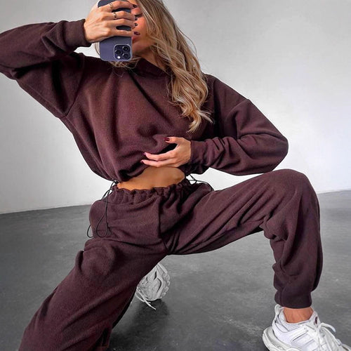 Kvindernes komfortable fleece jumpsuit med hætte og elastisk talje