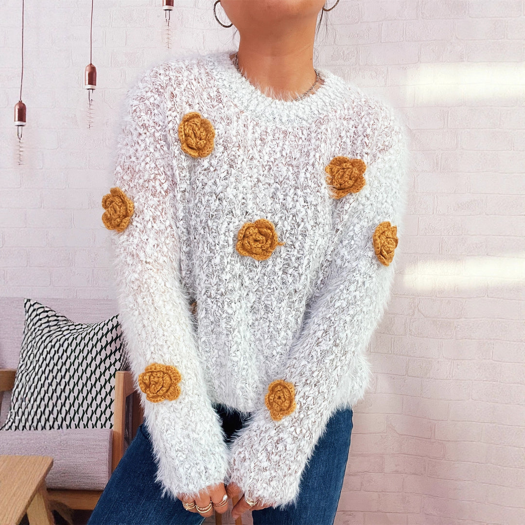 Kvindernes hyggelige strikket sweater med blomsterdetalje Stilla
