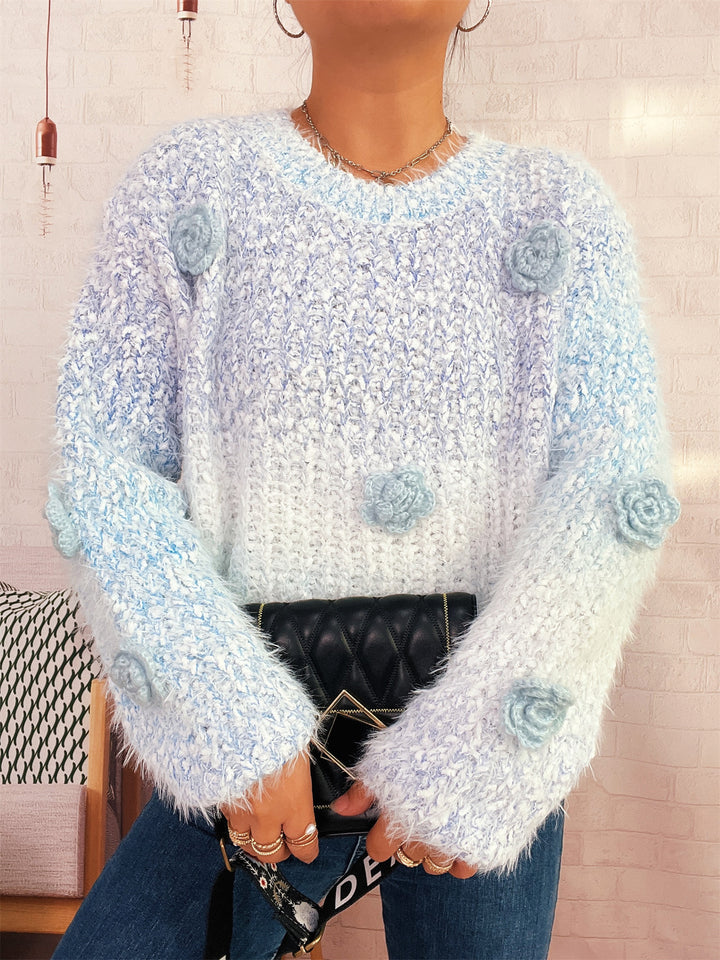 Kvindernes hyggelige strikket sweater med blomsterdetalje Stilla