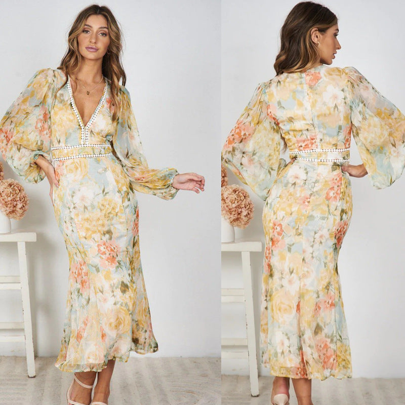 Dame Maxi-kjole med romantisk blomsterprint og elegante flæsedetaljer Stilla