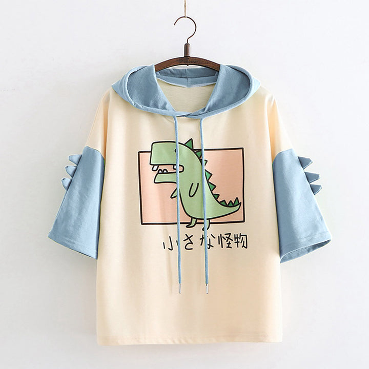 Dame Hoodie-T-shirt med spændende dino-design og stilige 3D-rugfløjter Stilla
