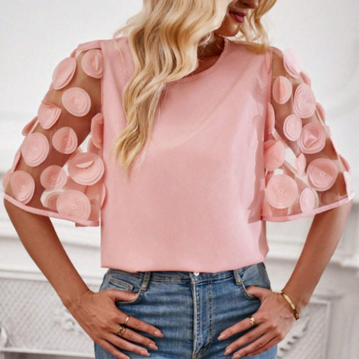 Dame moderigtig bluse med transparente puffærmer og runde applikationer Stilla