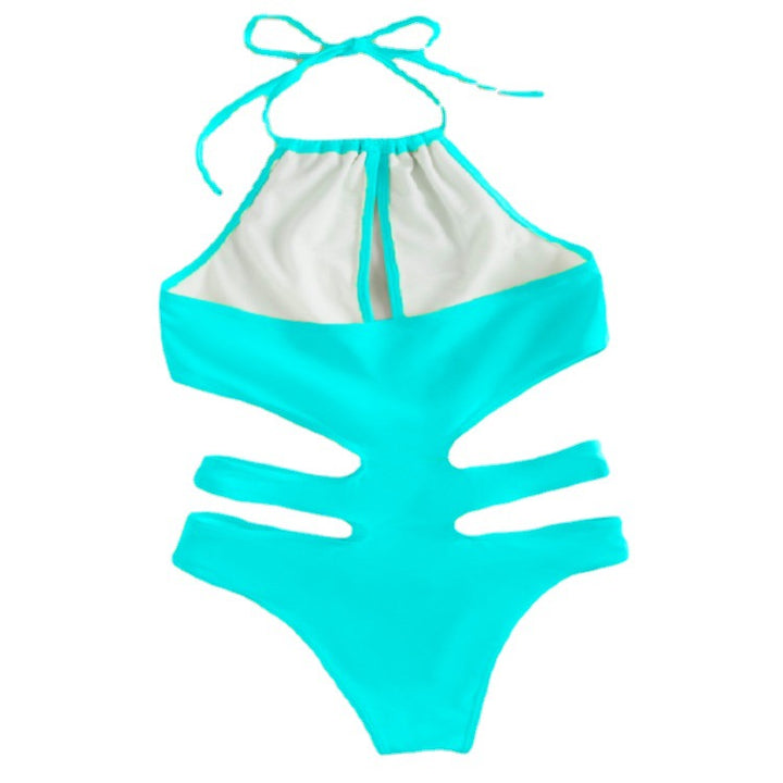 Dameonepiece badedragt med dyb V-udskæring og fashionable cut-out-detaljer Skovae