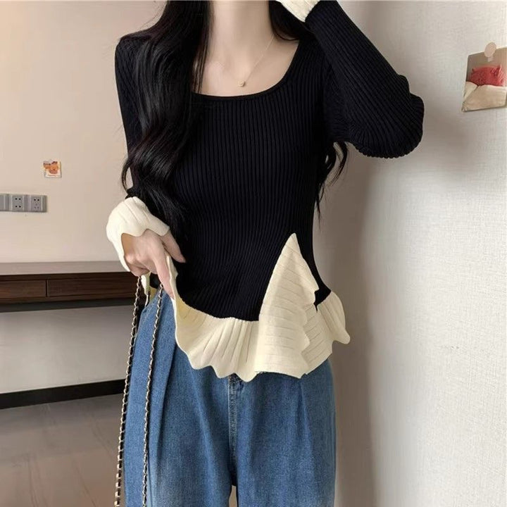 Kvinders fashionable ribstrikkede sweater med asymmetrisk kant Stilla