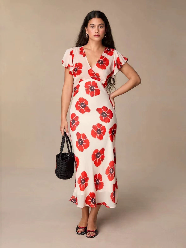 Dame maxikjole med floral design og elegant V-udskæring Stilla