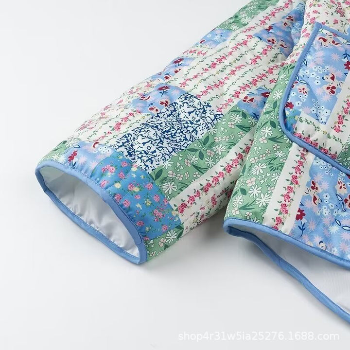 Dame Patchwork Polstret Jakke med Blomsterdesign og Praktiske Sidelommer Stilla
