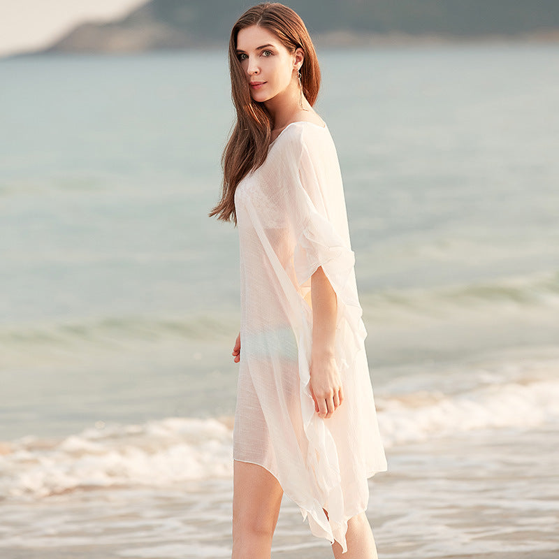 Damer elegant strandponcho med voluminøse flæsedetaljer Stilla