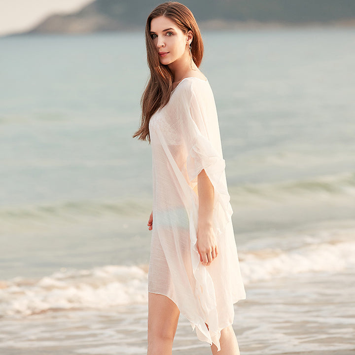 Damer elegant strandponcho med voluminøse flæsedetaljer Stilla