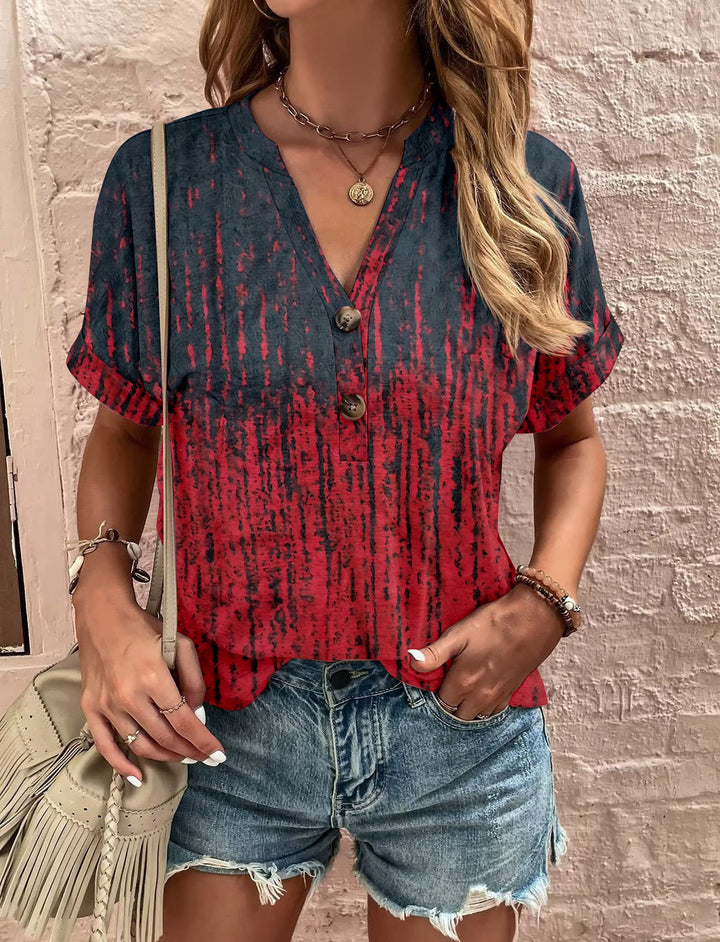 Damebluse med blomsterdesign og knaplukning Stilla