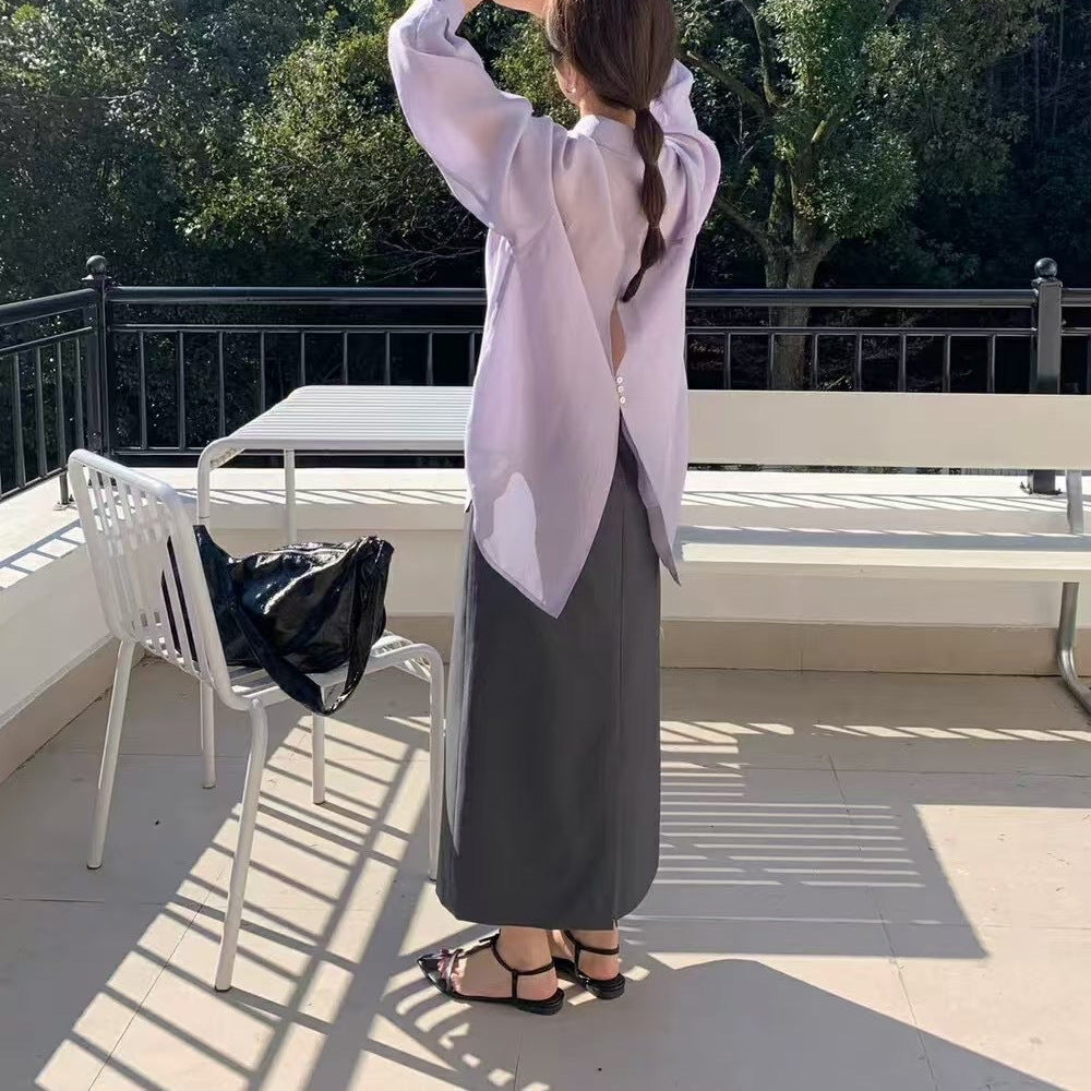 Dame Relaxed Fit Button-Up Bluse med unikt rygdetalje Stilla