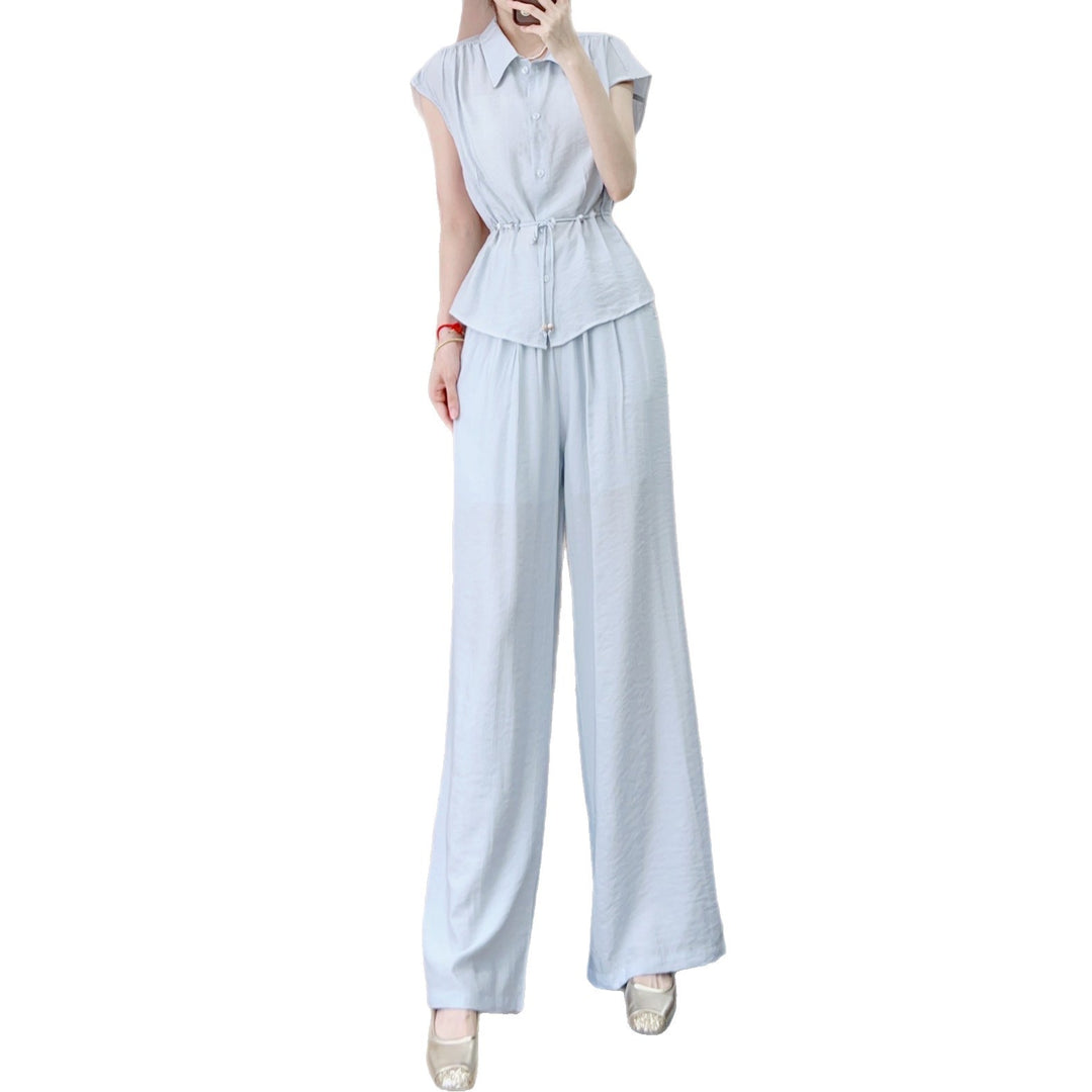 Dame jumpsuit med taljerbart design og elegante knapdetaljer Stilla