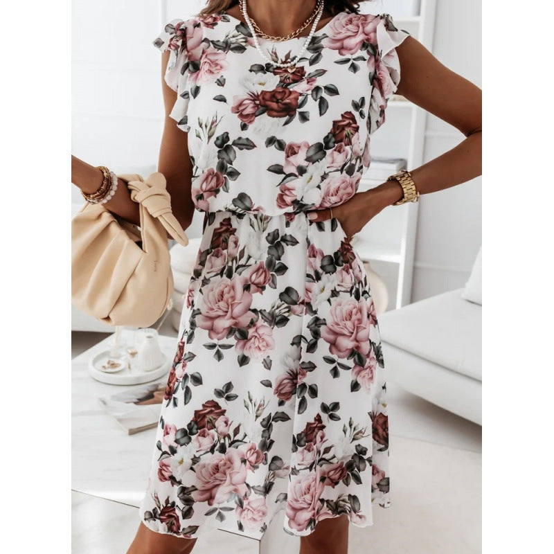 Dame sommerkjole med blomsterprint, flæsedetaljer og taljebælte Skovae