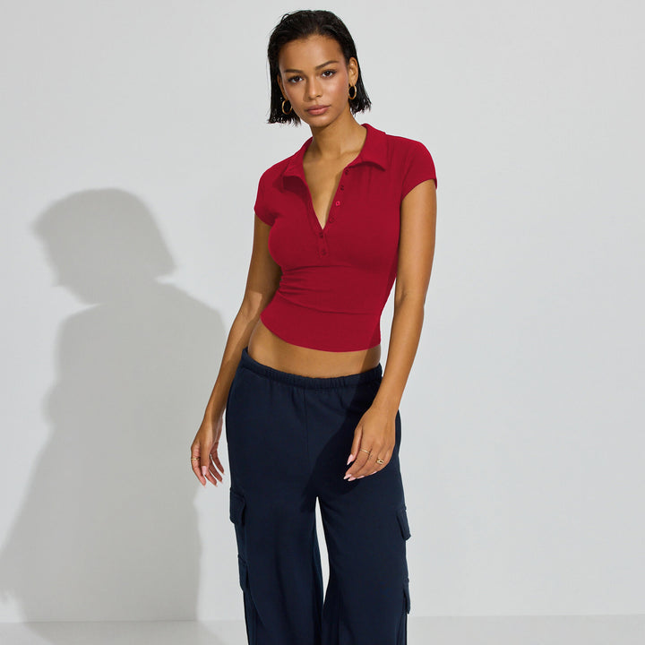 Dame Sports Crop-Top med dekorativ knapdetalje og figursyet snit Stilla