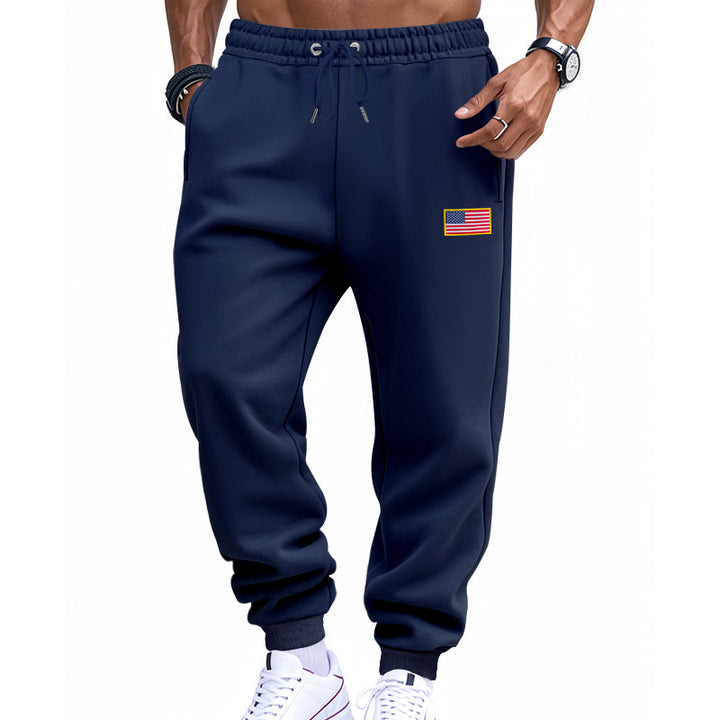 Herrer nan slank sweatpants med konisk hængende ben, elastisk tunneltræk og diskret flagapplikation Skovae