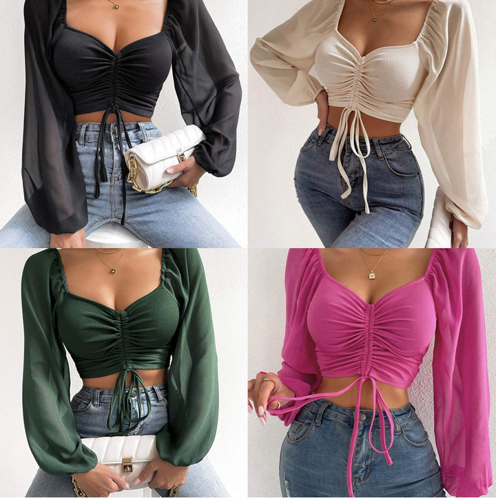 Dame Crop-Top med struktureret krop og elegante pufærmer Skovae