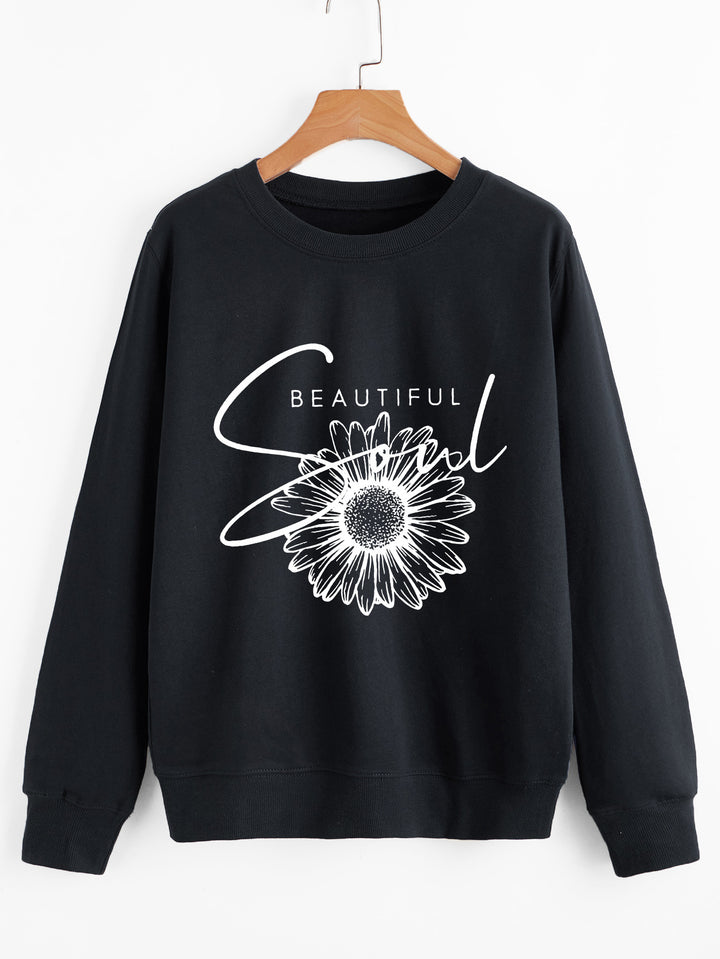 Kvindes sweatshirt med blomstermotiv og inspirerende tekst Stilla