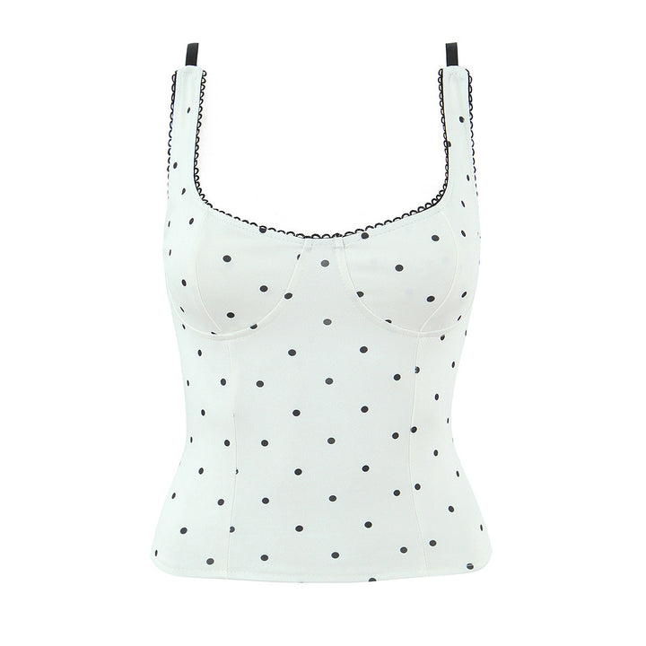 Dameoverdel med elegant polka-dot-look og fine detaljer Skovae