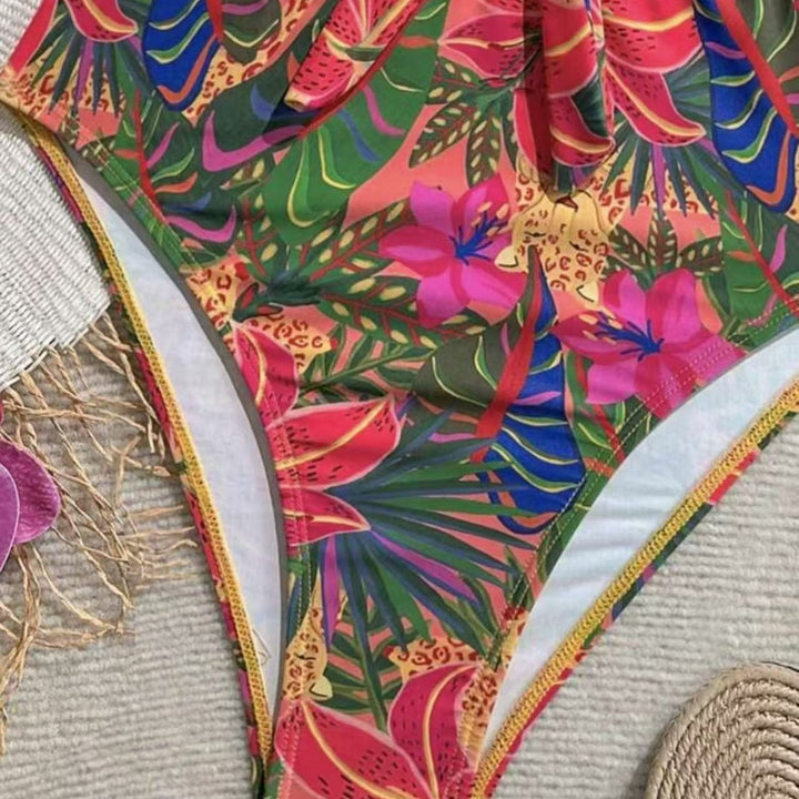 Dame one-piece badedragt med dekorativ knude detalje og legende blomstermønster Skovae