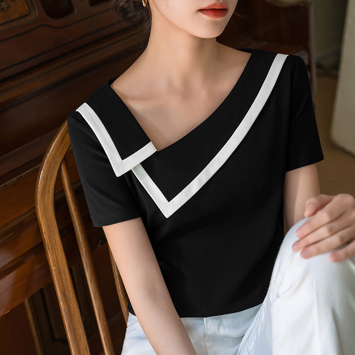 Dame elegant top med en moderne asymmetrisk krave og stilfulde kontrastaccenter Stilla