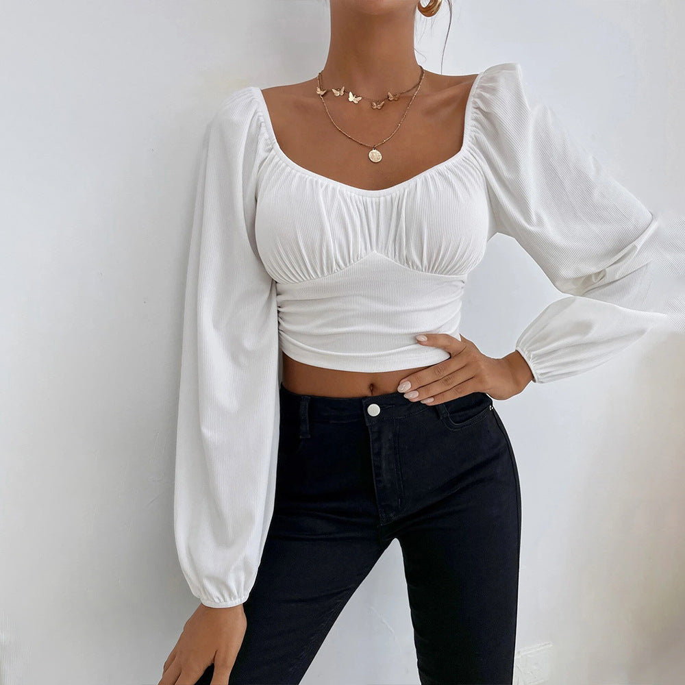 Kvindernes cropped top med stilfuldt pufærme-design og tætsiddende silhuet Stilla
