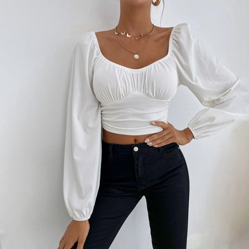 Kvindernes cropped top med stilfuldt pufærme-design og tætsiddende silhuet Stilla