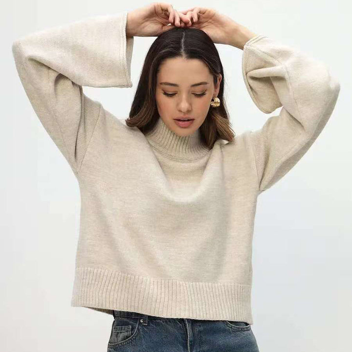 Kvindernes chunky strikket sweater med stående krave og voluminøse ærmer Stilla
