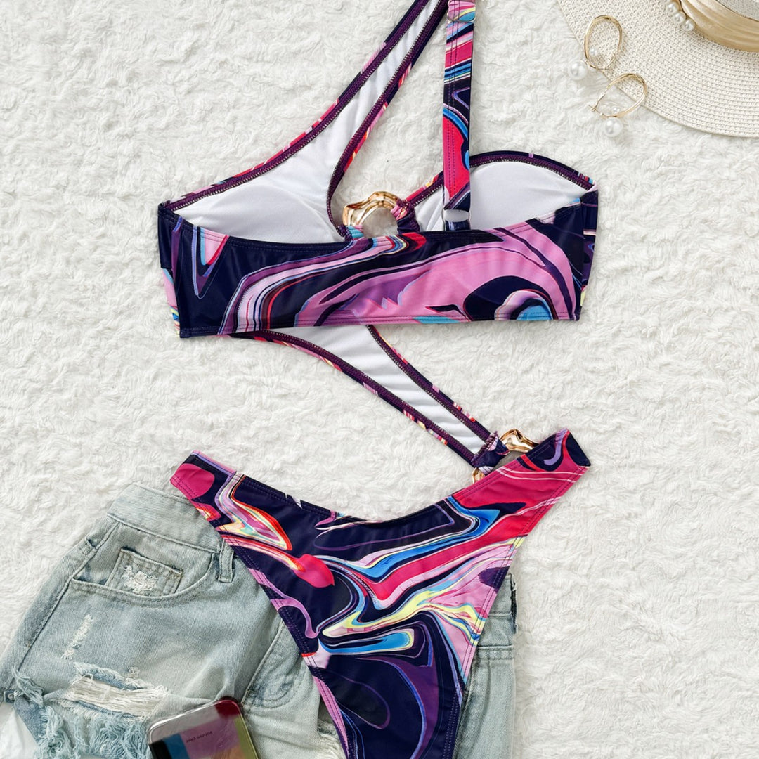 Damebikini med asymmetrisk design og gyldent ringdetalje Stilla