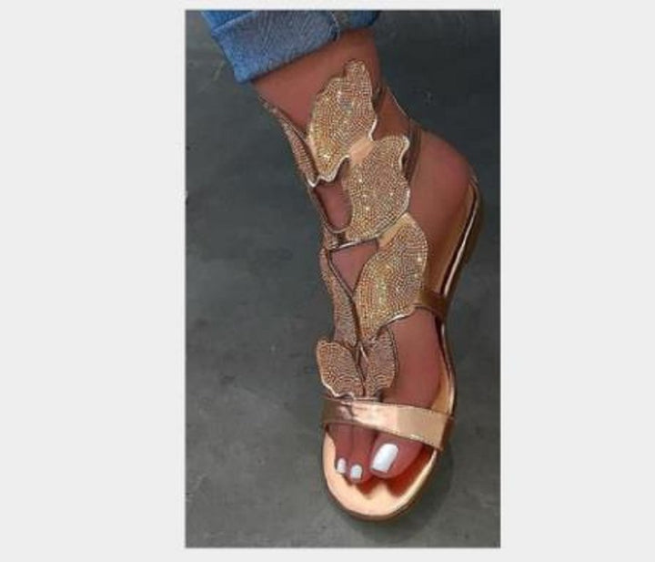 Dame Glitrende Sandaler med blomsterdesign og elegant rem Stilla