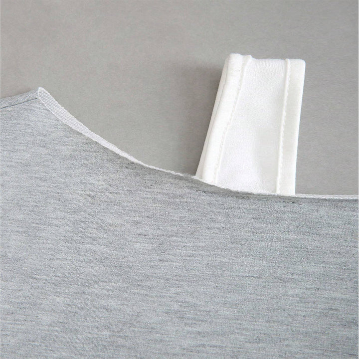 Kvinders cropped sweatshirt med asymmetrisk design og voluminøse ærmer Stilla