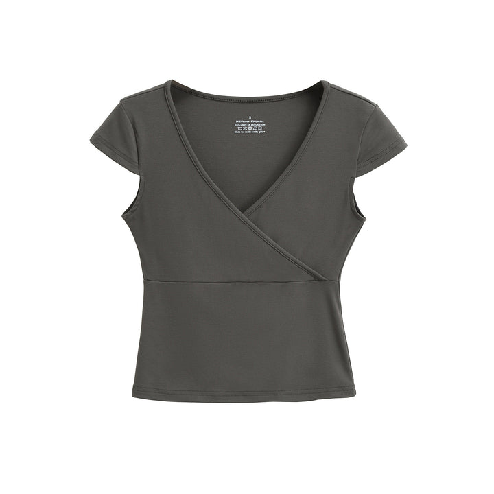 Dame indpakningsoverdel med elegant V-udskæring og figursyet design Stilla