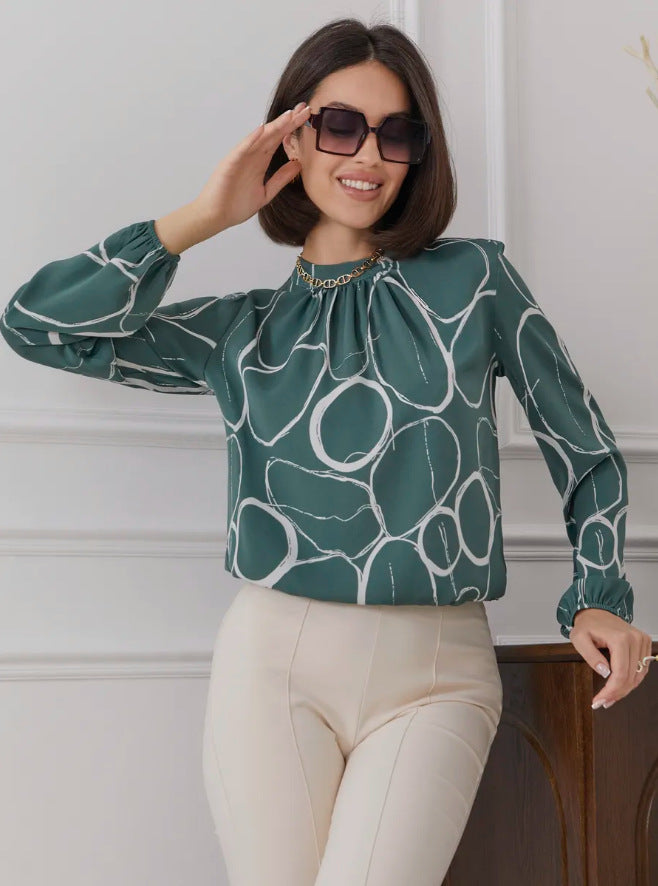Damebluse med elegant blomsterdesign og bredt ærme Stilla