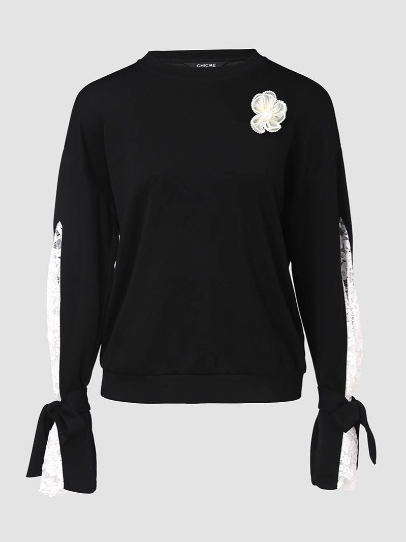 Dame top med elegante spids ærmer og fashionable detaljer Stilla