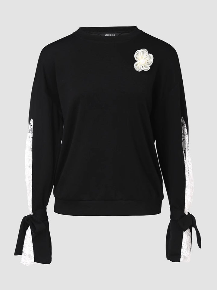 Dame top med elegante spids ærmer og fashionable detaljer Stilla