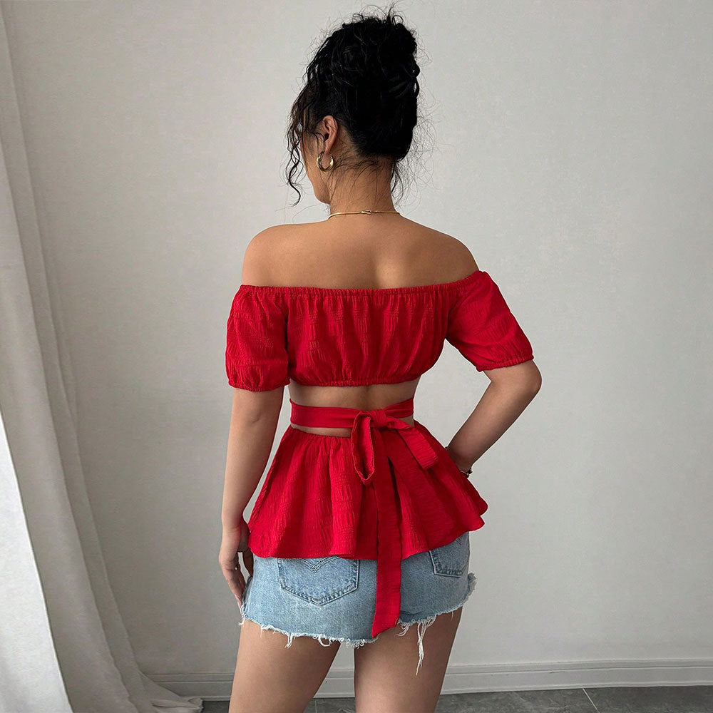 Kvinders off-shoulder bluse med flæsekant og sideløse udskæringer Stilla