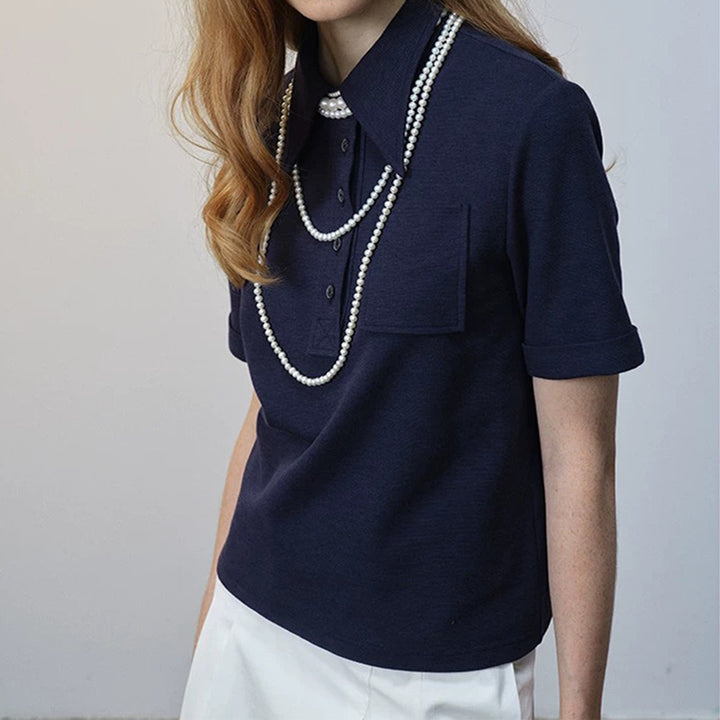 Dame polo shirt med klassisk krave og dekorerende knapdetaljer Stilla