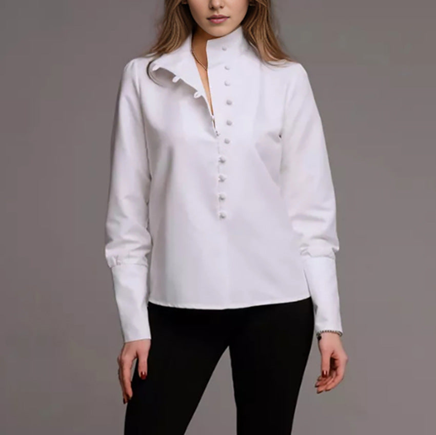 Damebluse med høj ståkrave og elegante pufærmer Stilla