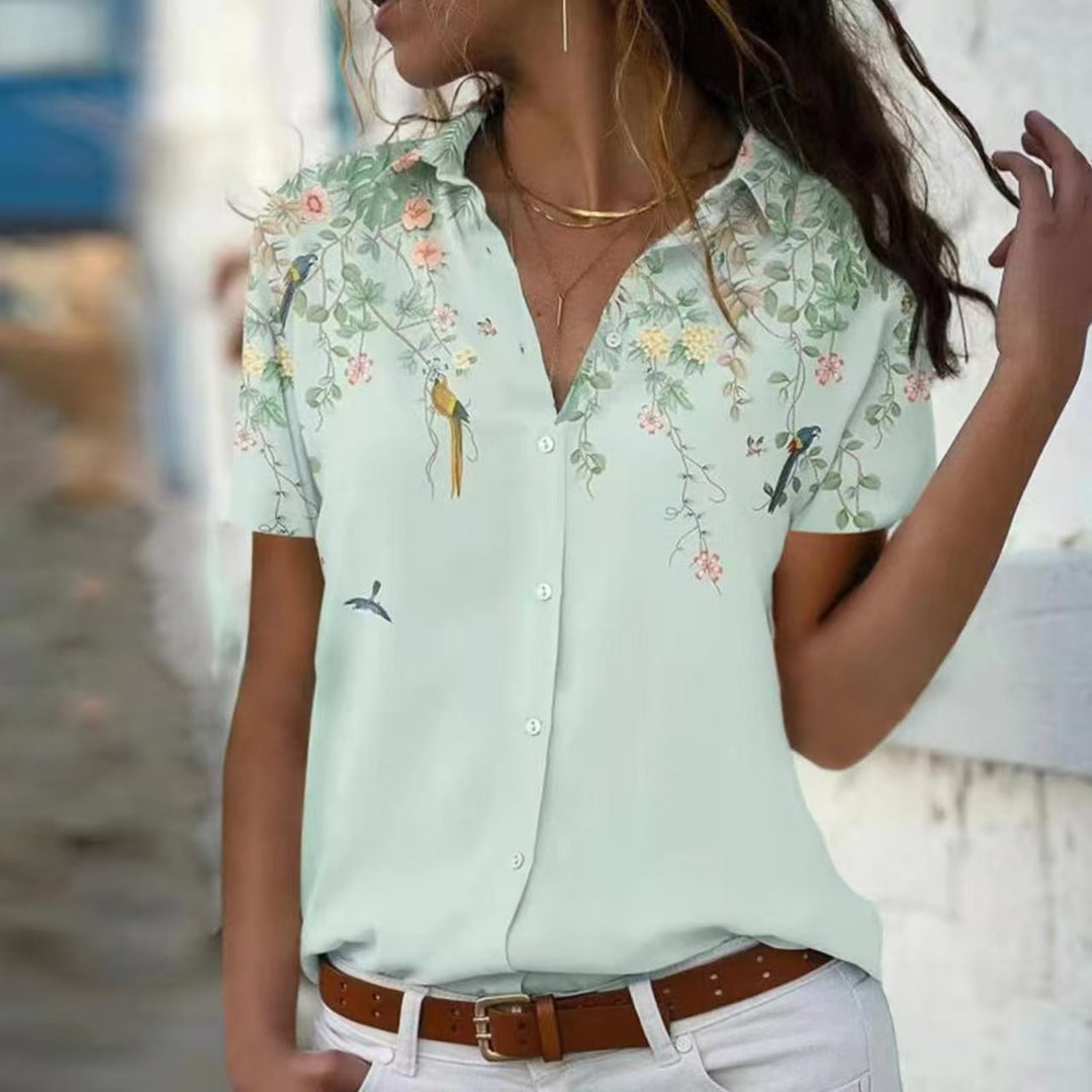 Damebluse med blomsterdesign og elegant snit Stilla
