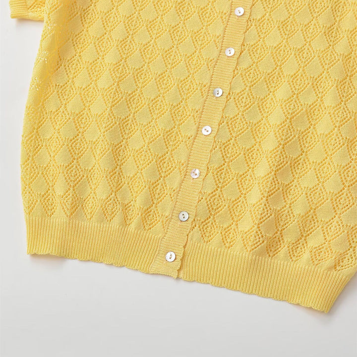 Dame kortærmet pullover med luftig hulstruktur og elegant krave Skovae