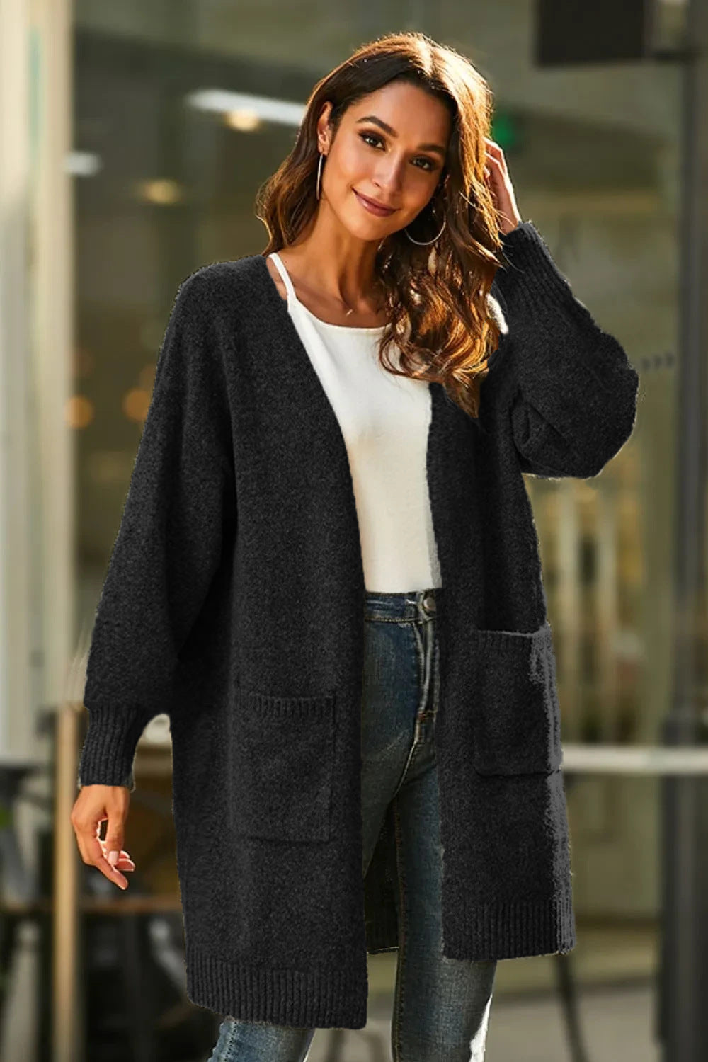 Kvindernes chunky strikket cardigan med dybe lommer og bredskårede ærmer Stilla
