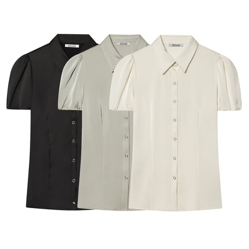 Damebluse med korte pufærmer og elegant knapliste Skovae
