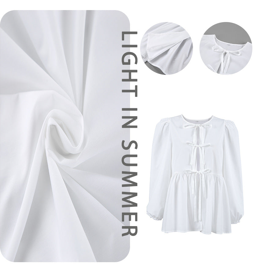 Damebluse med draperinger og dekorative sløjfer Stilla